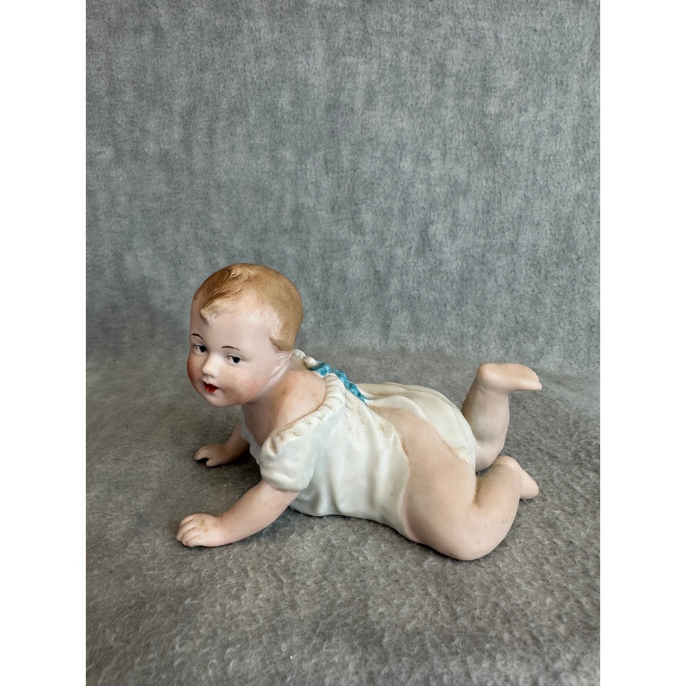 Vintage Porcelain Baby Figurine Crawling White Dress Blue Bow Detailed Unmarked